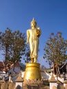 Walking golden buddha statue viewpoint in Nan Royalty Free Stock Photo