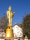 Walking golden buddha statue viewpoint in Nan Royalty Free Stock Photo