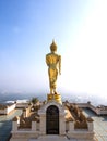 Walking golden buddha statue viewpoint in Nan Royalty Free Stock Photo