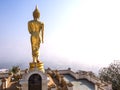 Walking golden buddha statue viewpoint in Nan Royalty Free Stock Photo