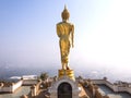Walking golden buddha statue viewpoint in Nan Royalty Free Stock Photo