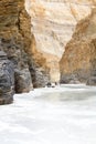 Walking through a gorge on the frozen Zanskar River Royalty Free Stock Photo