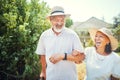 Walking, happy and senior Asian couple in garden for bonding, healthy relationship and love. Retirement, marriage and Royalty Free Stock Photo