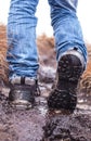 Walking hiking shoes on a muddy terrain