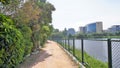 Walking lane of iblur lake with green cover and clear cloudy skyn and cityscape infrastructure