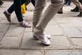 Walking legs on European cobbled street motion blur