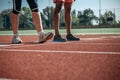 Walking legs of white and black sportsmen Royalty Free Stock Photo