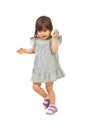 Walking little girl talk to cell phone Royalty Free Stock Photo