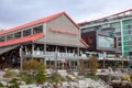 Walking the Lonsdale Quay boardwalk to `The Shipyards`, a newly gentrified area overlooking Vancouver Royalty Free Stock Photo