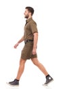 Walking man in khaki uniform Royalty Free Stock Photo