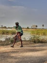 Walking man in our village lake side rode in lockdown in India Tamil Nadu.