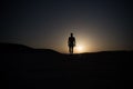 Walking man silhouette at sunset sky Royalty Free Stock Photo