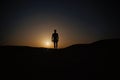 Walking man silhouette at sunset sky Royalty Free Stock Photo