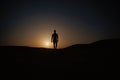 Walking man silhouette at sunset sky Royalty Free Stock Photo