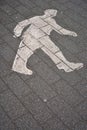 Walking man spraypainted on a road Royalty Free Stock Photo