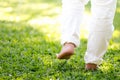 The practice of walk back and forth in the grass of men in white pants, Meditation, peaceful and refreshing