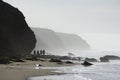 Walking on misty beach