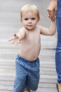 Walking with mom. Portrait of a cute baby boy walking with his mother. Royalty Free Stock Photo