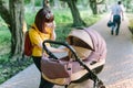 Walking Mother with baby carriage