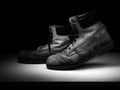 Walking old, work boots, monochrome black and white. Royalty Free Stock Photo