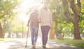 Walking, park and and woman with elderly mother for bonding, assistance and help outdoors. Nature, family and female Royalty Free Stock Photo