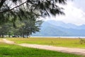 Walking path between fields with a background of mountains Royalty Free Stock Photo