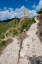 Walking path and La Tour Regine tower at Lastours