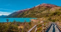 Walking path at Lago Argentino near huge Perito Moreno glacier in Patagonia in golden Autumn, South America Royalty Free Stock Photo