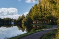 Walking Path by Lake with Fountian and Reflections off Water