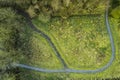 Walking path in a park with green fields and trees. Aerial top down view. Nature scene. Nobody Royalty Free Stock Photo