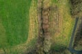 Walking path in a park with green fields and trees. Aerial top down view. Nature scene. Nobody Royalty Free Stock Photo