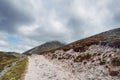 Walking path to the top of a mountain. Croagh Patrick, Westport, county Mayo, Ireland. Nobody. Low cloudy sky. Popular hiking and Royalty Free Stock Photo