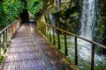 Walking path with a waterfall, beautiful nature and garden architecture Royalty Free Stock Photo