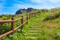 Walking path with a wooden fence and amazing nature