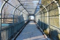 Enclosed walkway with chain link fence