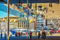 The walking public are reflected in mirror ceiling - canopy