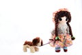 Heel Puppy, let`s go for a walk. New pose. Vintage girl rag doll with her puppy; presented on a plain white background.