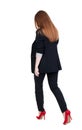 Walking red head business woman. Royalty Free Stock Photo