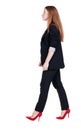 Walking red head business woman. Royalty Free Stock Photo