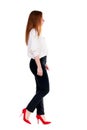 Walking redhead business woman. Royalty Free Stock Photo