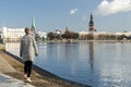 Walking by the river Daugava on a clear winter day Royalty Free Stock Photo