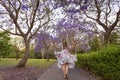 Walking among the rows of purple Jacaranda trees