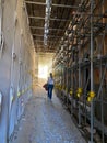 Walking through a scaffolding tunnel in the from earthquake destroyed town of L\'Aquila, Italy