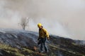 Walking through the scorched grounds during a controlled burn