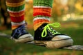 Walking the slackline in sneakers and colour socks Royalty Free Stock Photo