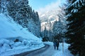 Walking on slippery road in snowy alpine landscape