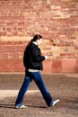 Walking sms man Royalty Free Stock Photo