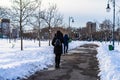 Walking on snowy path in a park of Bucharest, Romania, 2020