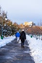 Walking on snowy path in a park of Bucharest, Romania, 2020