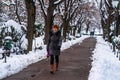 Walking on snowy path in a park of Bucharest, Romania, 2020